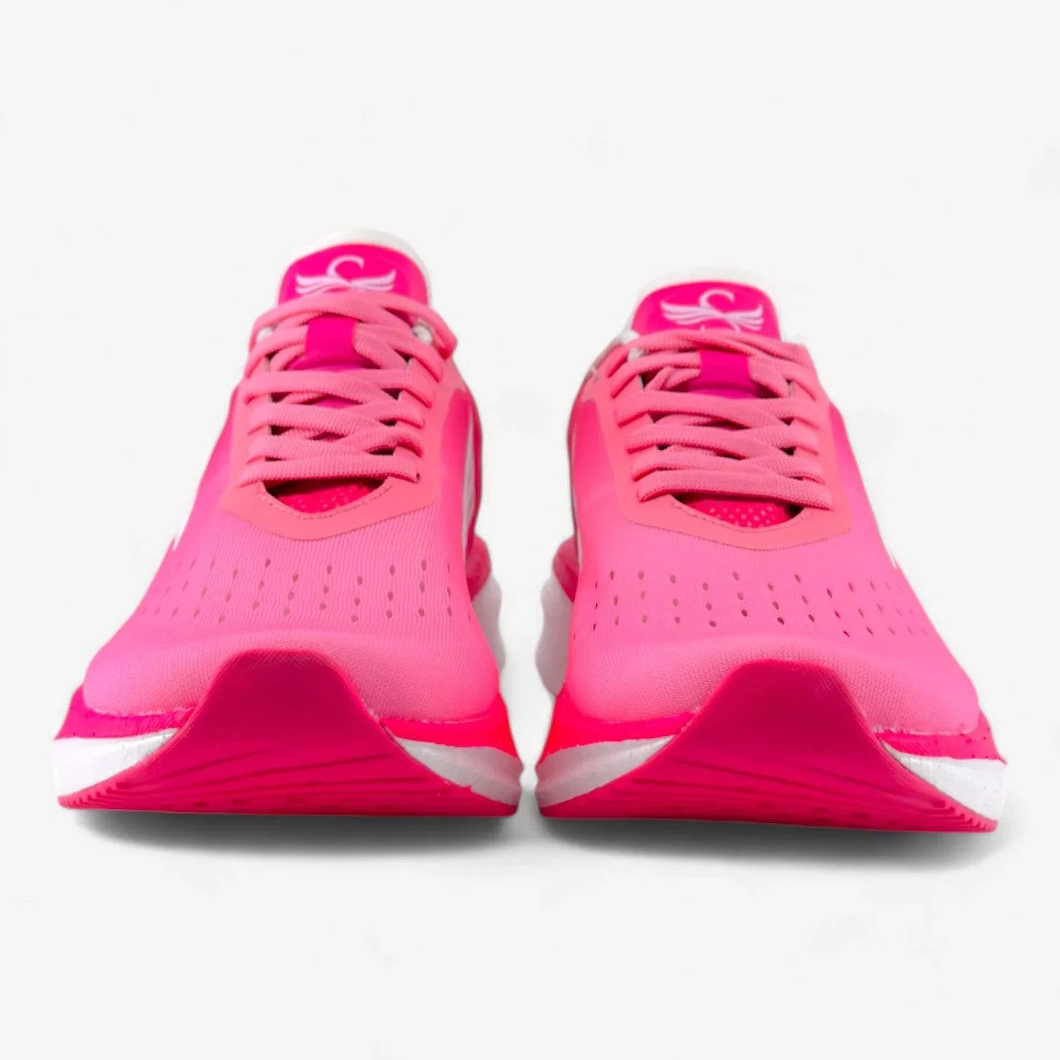 Bright pink women's running shoes with laces, mesh upper, and white soles, front view