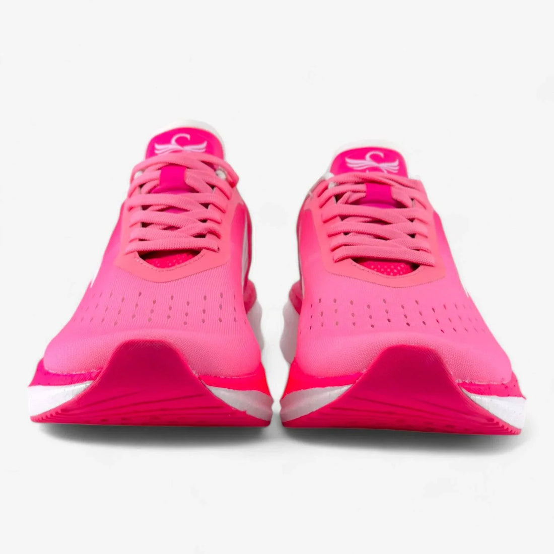 Bright pink women's running shoes with laces, mesh upper, and white soles, front view