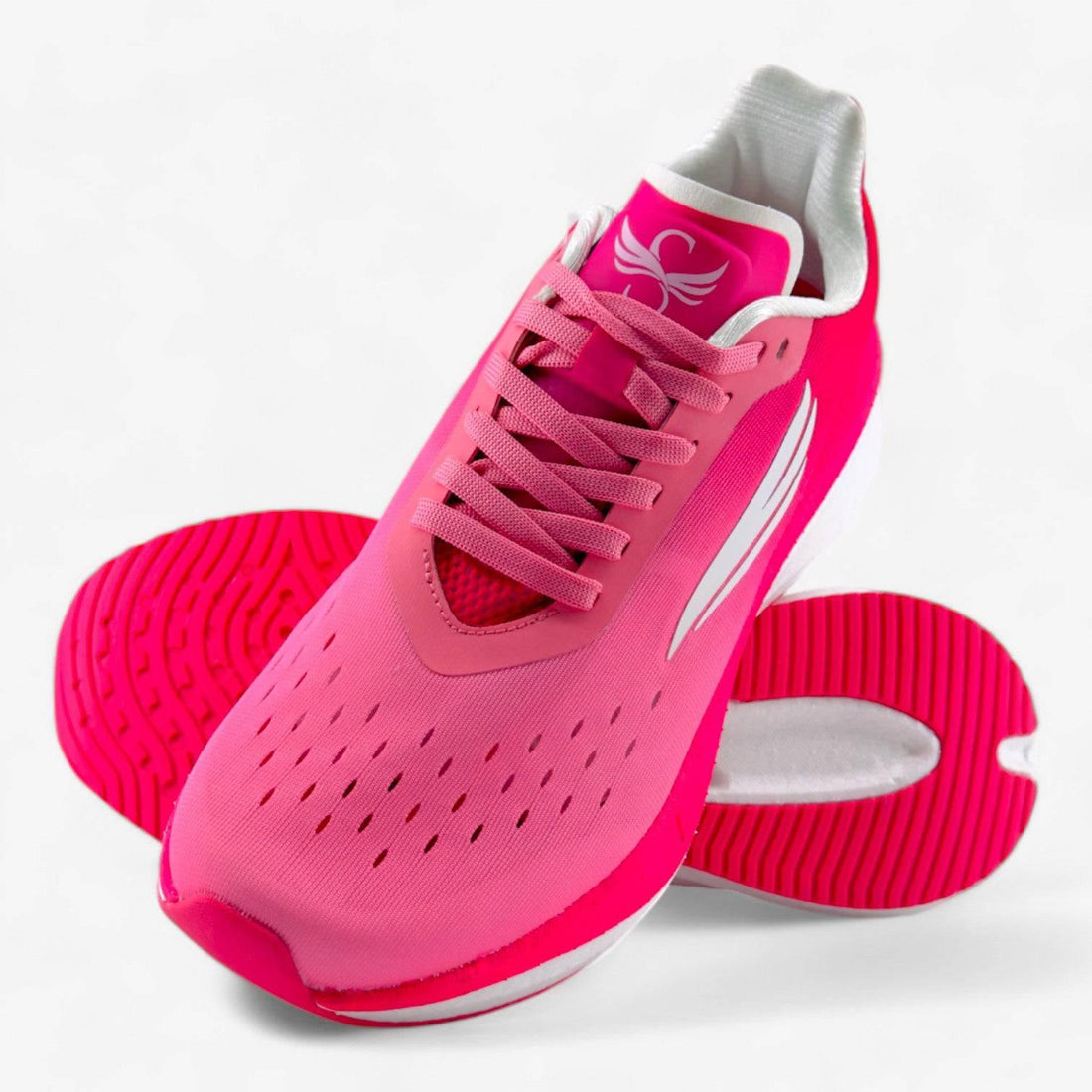 Pink women's running shoe with breathable mesh upper and cushioned sole, athletic footwear