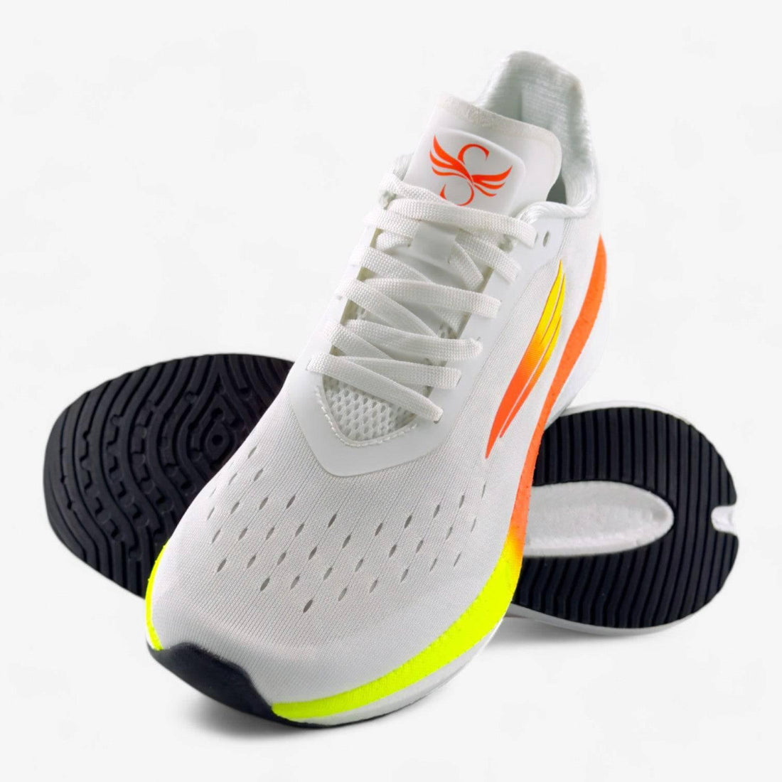 White women's running shoe with orange and yellow accents, breathable mesh, black sole