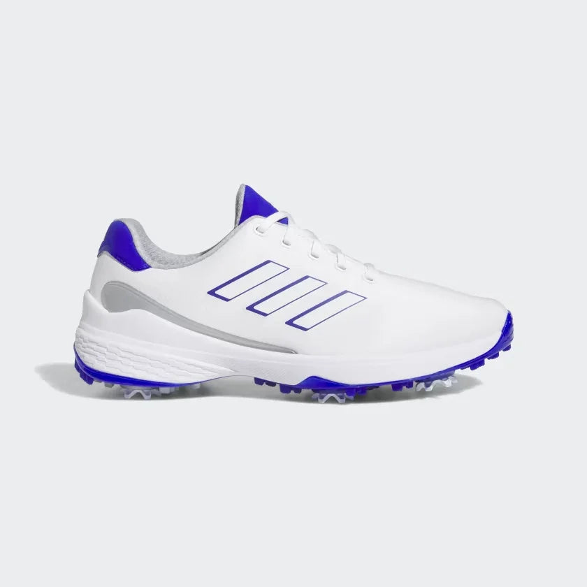 White men's athletic golf shoe with blue accents, spiked sole, and lace-up design