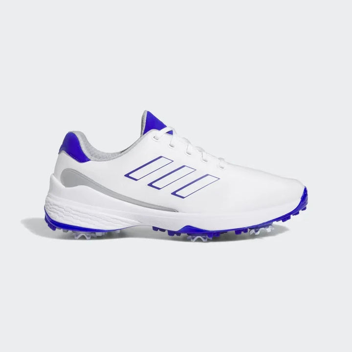 White men's athletic golf shoe with blue accents, spiked sole, and lace-up design