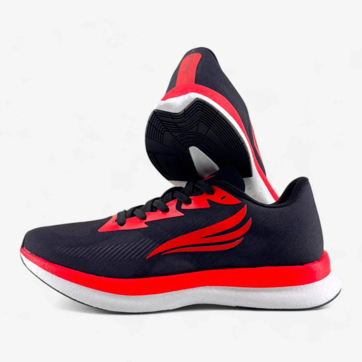 Men's athletic running shoes in black with red accents and cushioned white sole