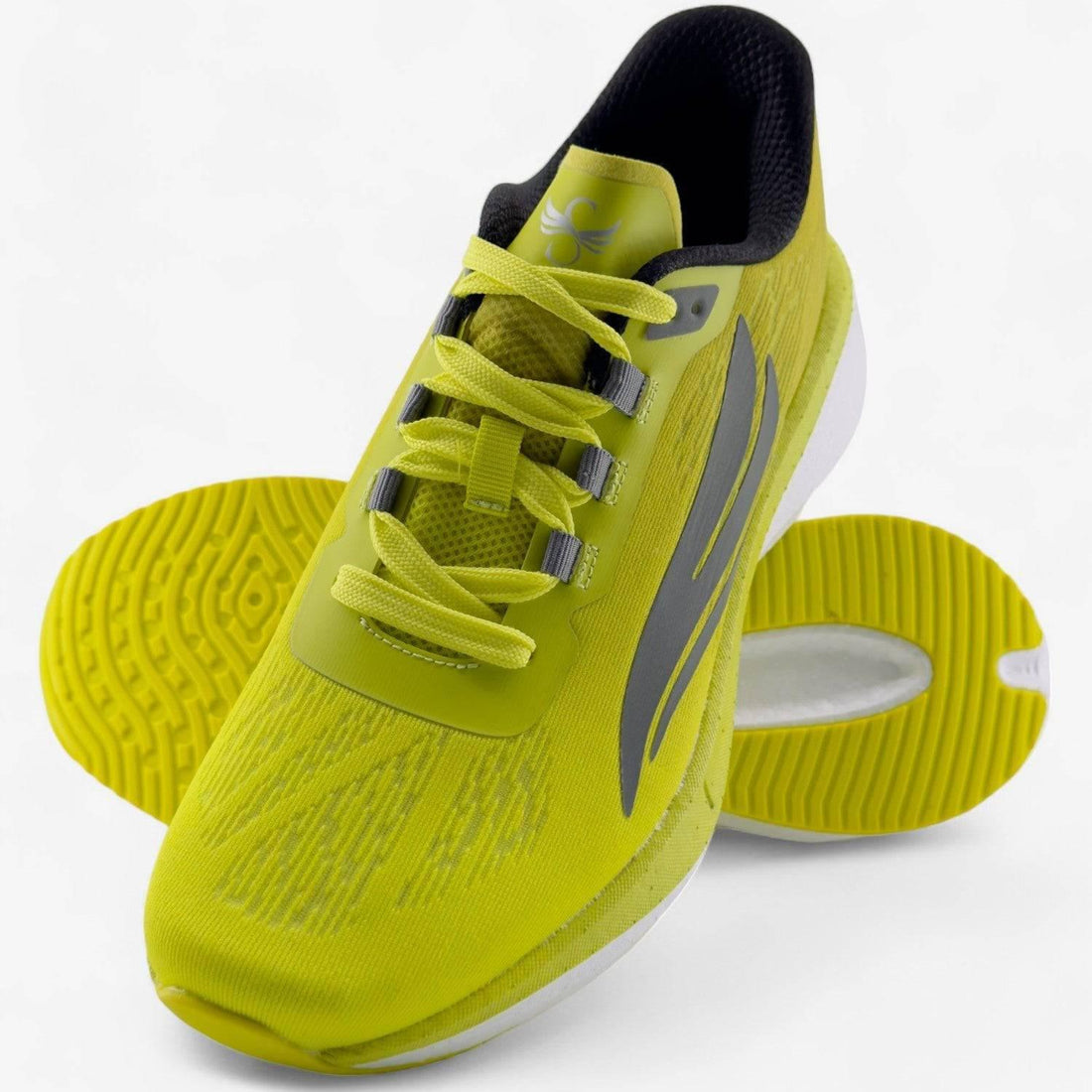 Yellow men's running shoe with grey accents, breathable mesh upper, and textured sole