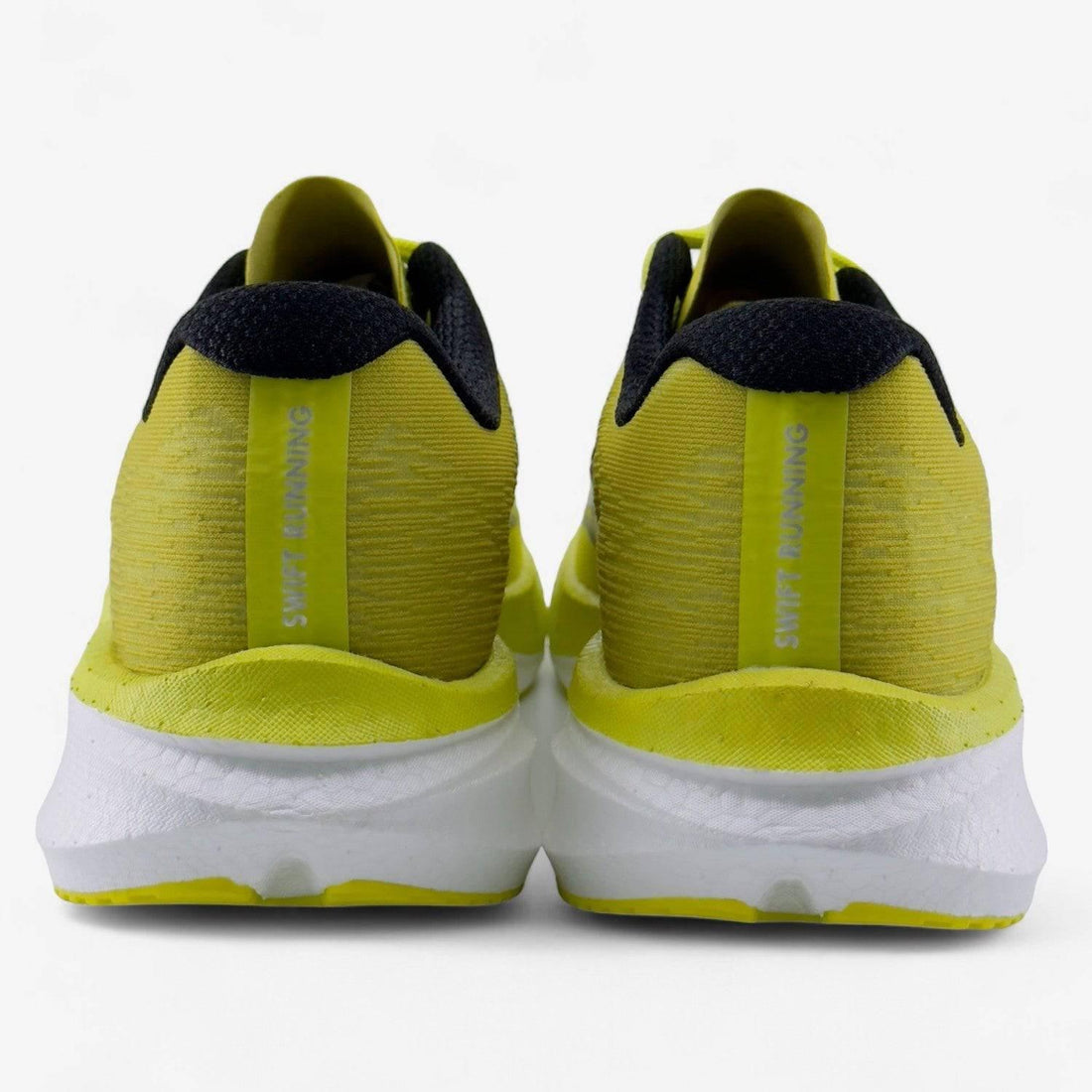 Rear view of yellow men's running shoes with black collars and white soles