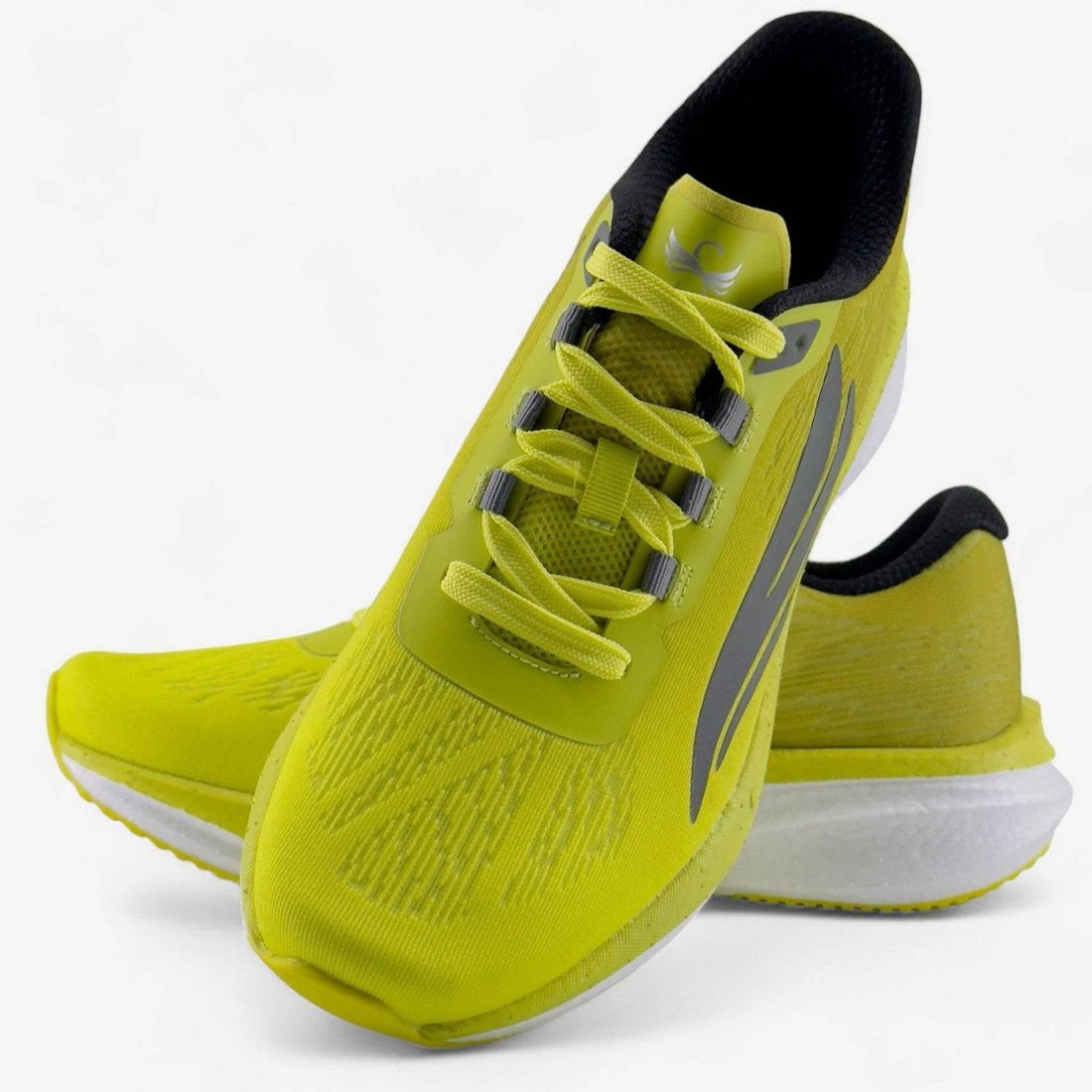 Yellow men's running shoes with black accents and mesh upper on white background