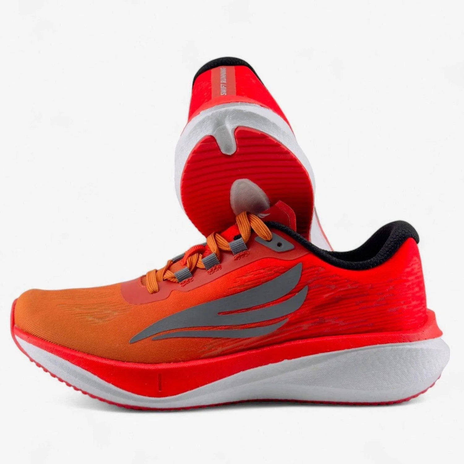 Bright orange and red men's running shoes with gray accents and white cushioned soles