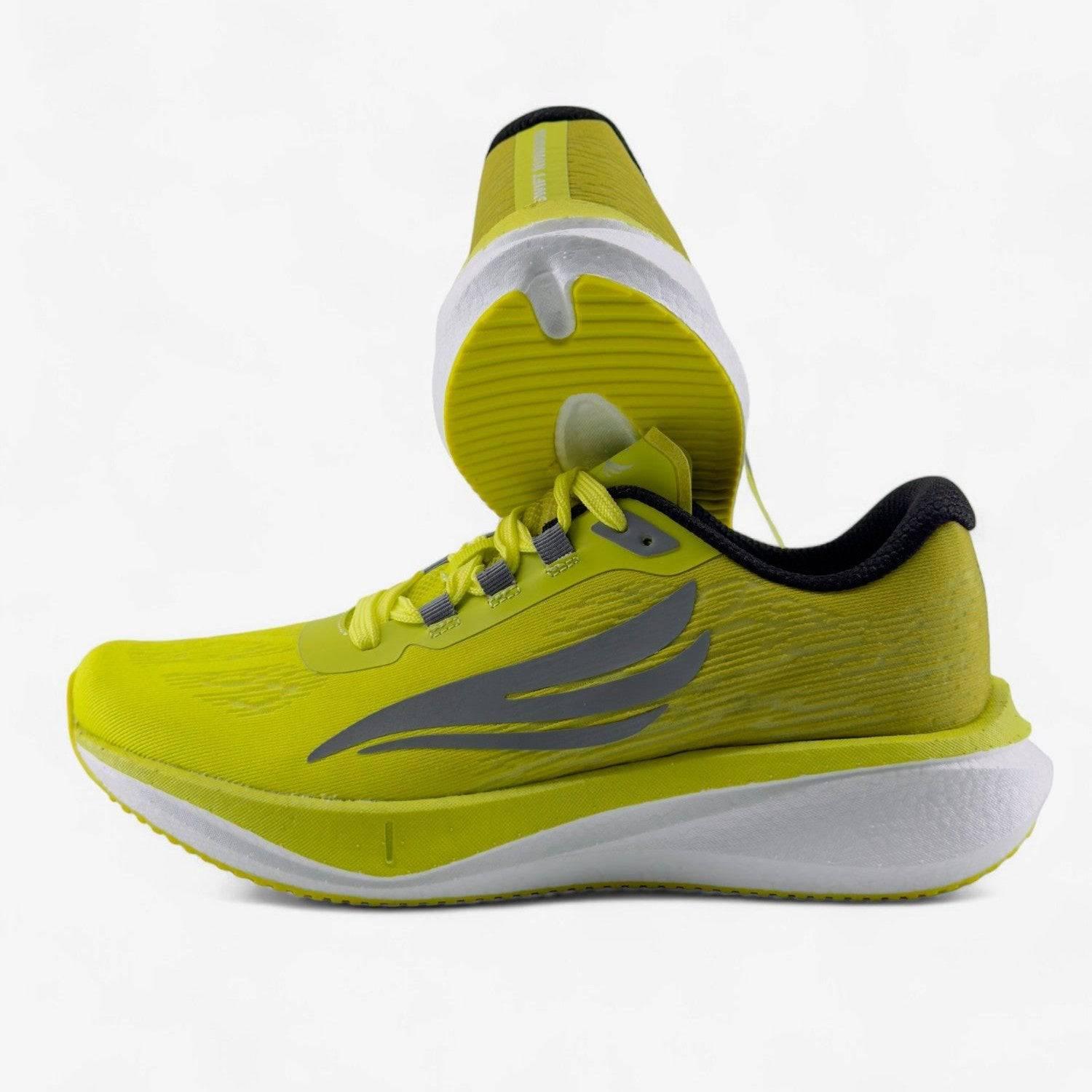 Yellow men's running shoes with cushioned sole and gray accents on white background